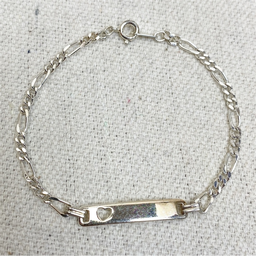 Silver tone Figaro link ID Bracelet with heart cut out